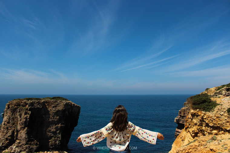 Arms wide at Praia do Amado.