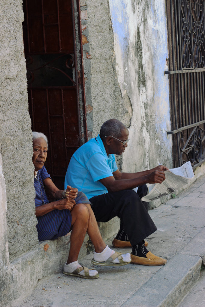 Watching the street go by.