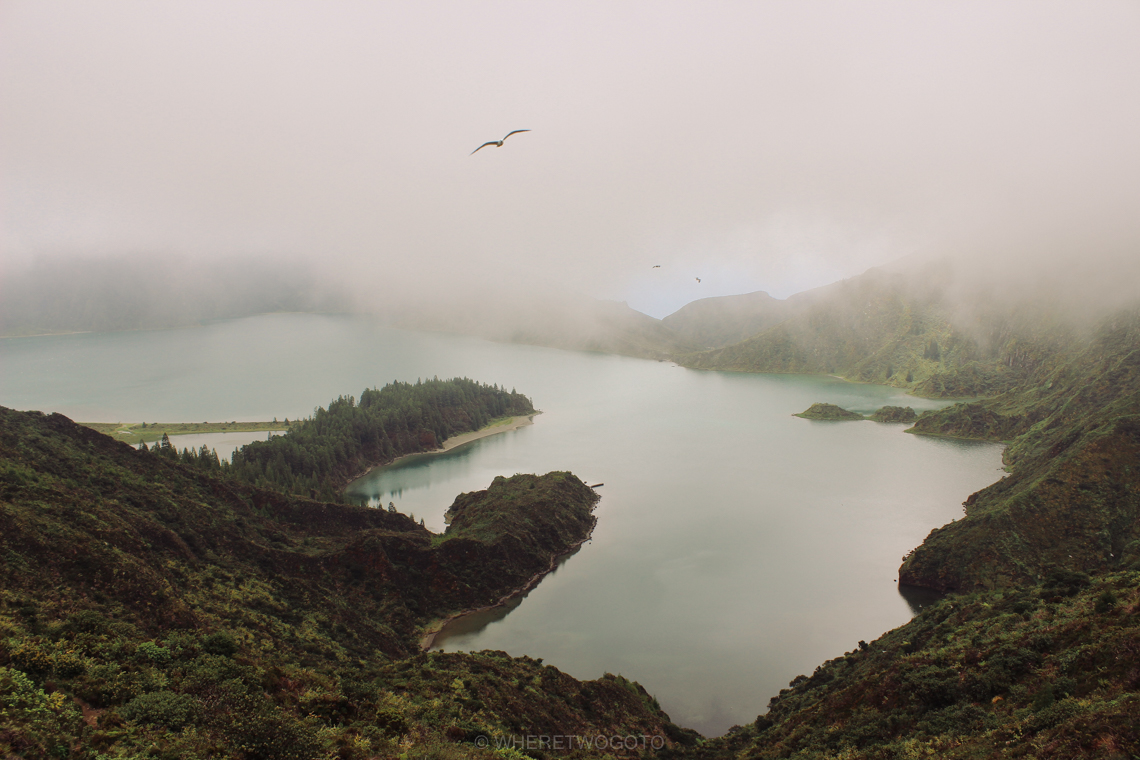 Lagoa do Fogo crater lake half hidden in mist on Sao Miguel island, Azores