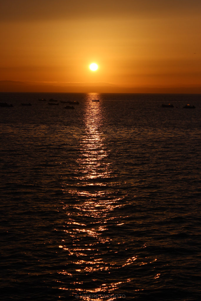 The sun goes down over the estuary.